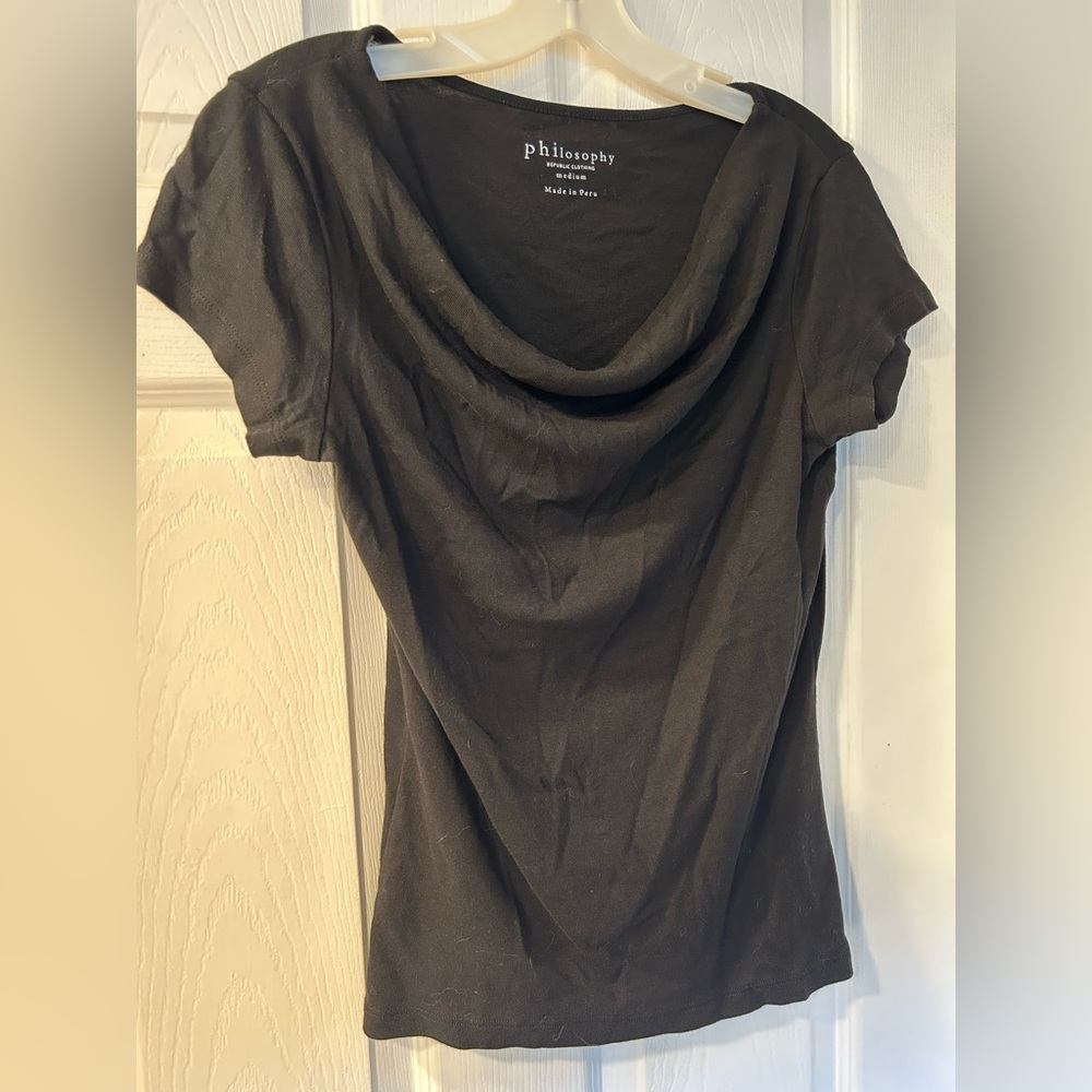 Basic black top with flattering neckline.